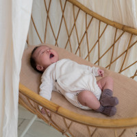 newborn_cross-over_body_pointelle_oatmeal_lifestyle.jpg